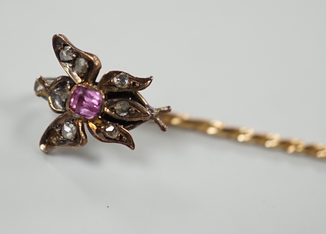 A Victorian yellow metal, pink stone and rose cut diamond set bug stick pin, 72mm, gross weight 1.6 grams.